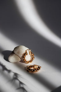 Gold Leaf Drop Earrings worn on model